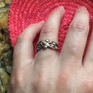 Silver ring with open leaf pattern